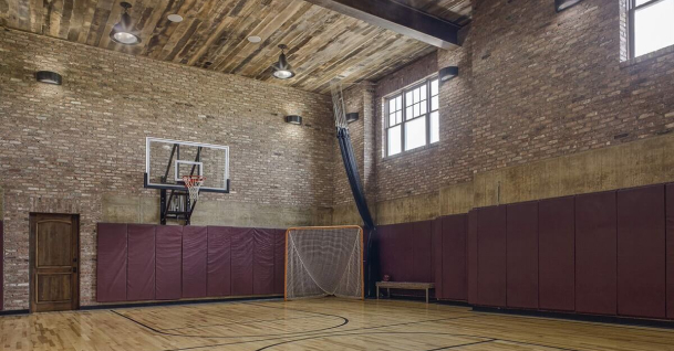 A basketball court in Florida with brick walls.